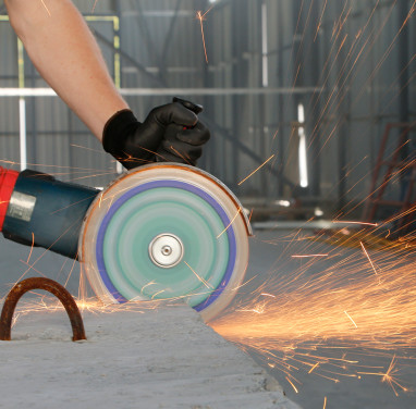 Cutting construction materials on an angle grinder